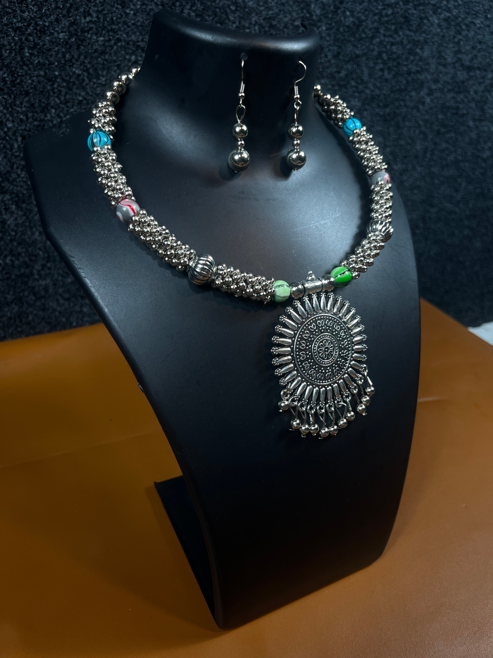 Explore the beautiful Navratri Oxidized Silver Necklace Set with Colorful Beads. Perfect for festive celebrations and traditional events. Shop now at Shree Pramukh Jewellery!